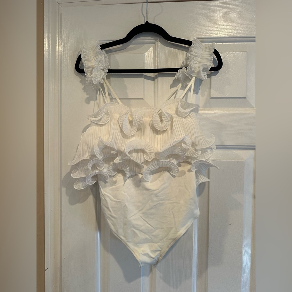 Ruffled White One-Piece Bodysuit